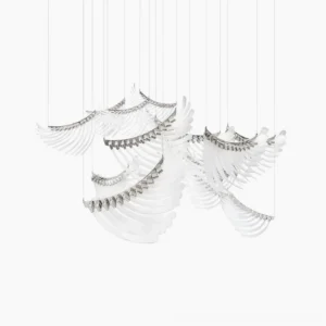Angel Wings Chandelier - Three-cluster sculptural LED installation with layered stainless steel feathers and prismatic glass, suspended in minimalist studio setting