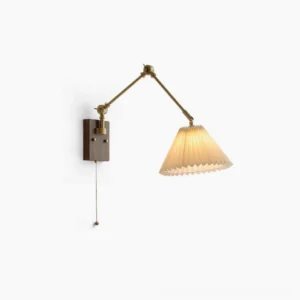 Angeline swing arm wall lamp with brass joints and walnut wooden base, pleated white fabric shade, frontal product view on white background showing full design