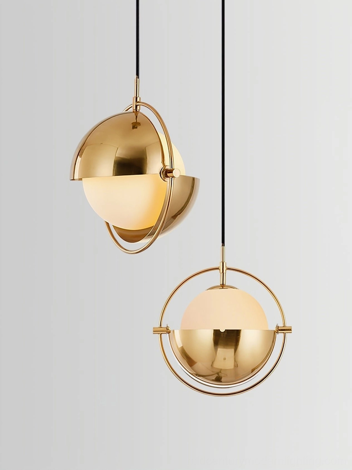 Multiple Anix pendant lamps in various finishes creating coordinated mid-century modern lighting scheme