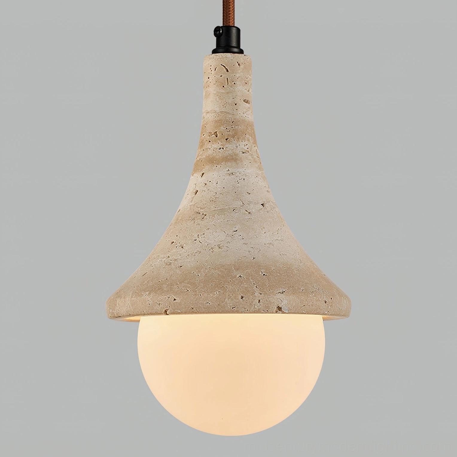 Close-up detail of Annadel travertine pendant showing porous stone texture and craftsmanship