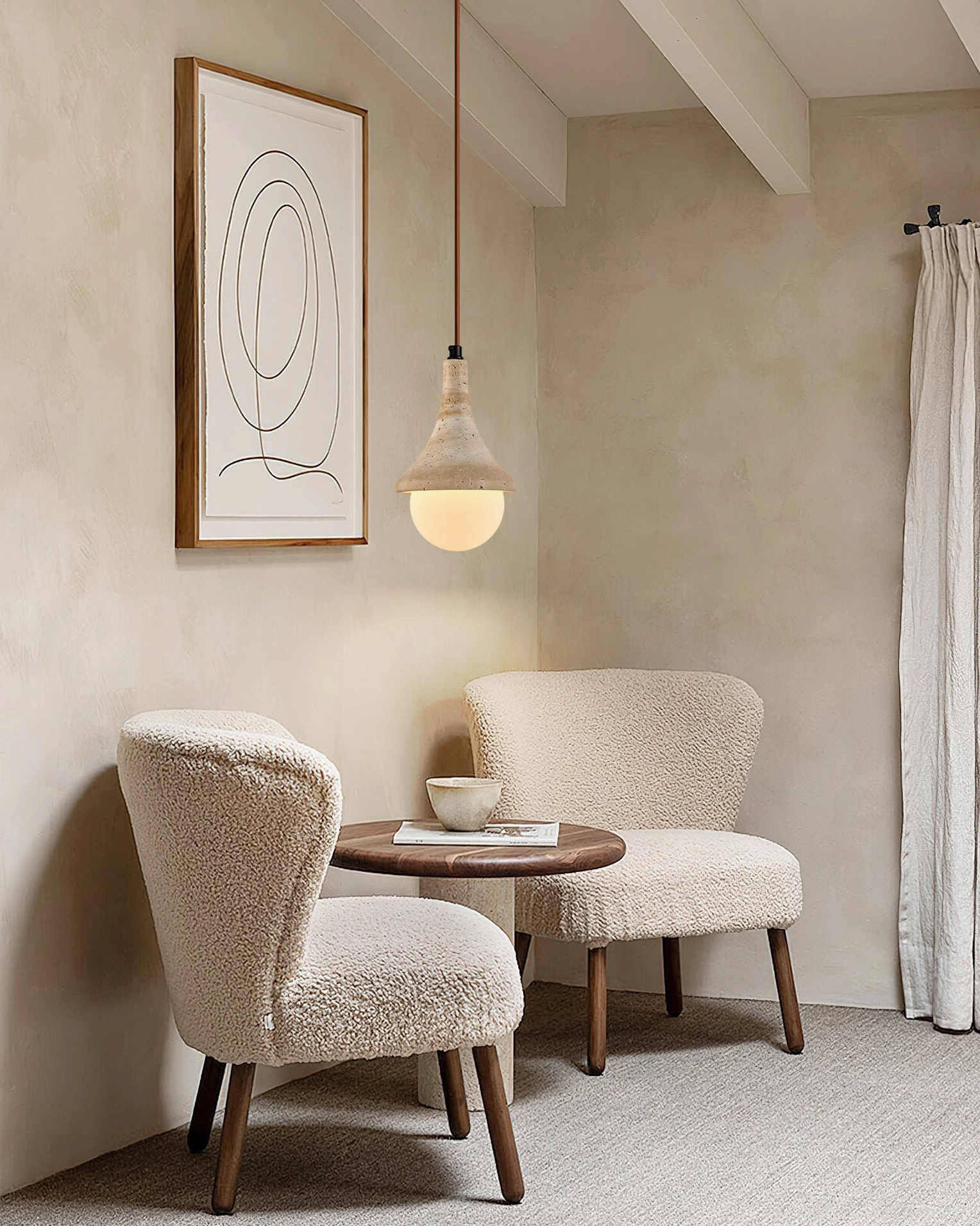 Annadel travertine pendant fixture in minimalist lounge area demonstrating mid-century modern interior styling