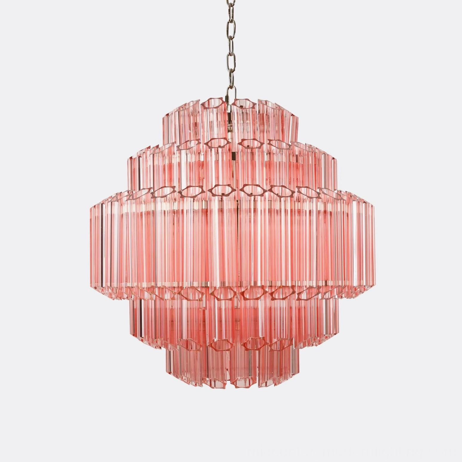 Antella Sunburst Chandelier studio photograph - pink tiered glass pendant with geometric cutout details capturing light refraction