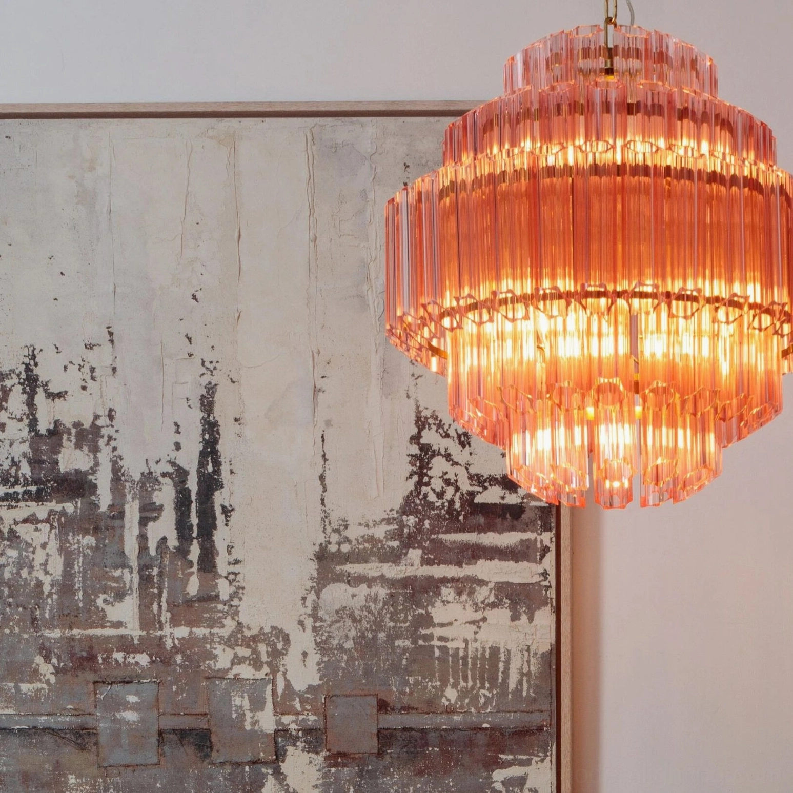Antella Sunburst Chandelier side angle view - mid-century modern pink glass chandelier with sculptural geometric design in home setting