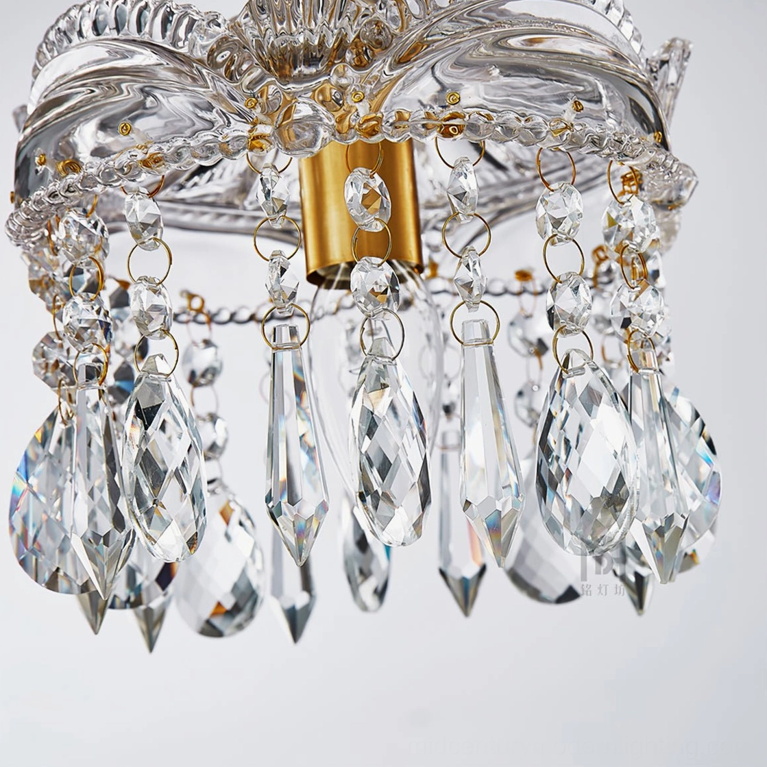 Cut crystal glass and brass metal components detail, linked crystal pendants close-up assembly