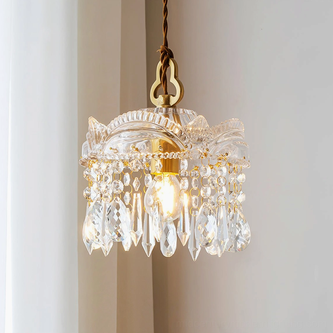 Close-up of layered crystal pendants with brass hardware, luxe vintage chandelier detail shot