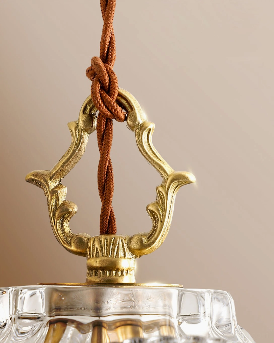 Antigua crystal pendant chandelier illuminated, vintage brass with crystal glass in interior setting