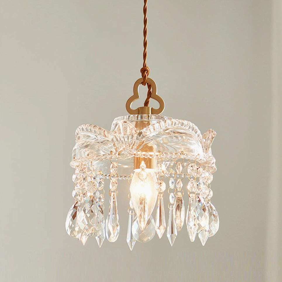 Vintage-style crystal pendant chandelier with brass accents, elegant European-inspired design detail