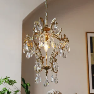 Antique crystal birdcage pendant in cozy living room setting with warm gold finish and decorative scrollwork, three-quarter angle view