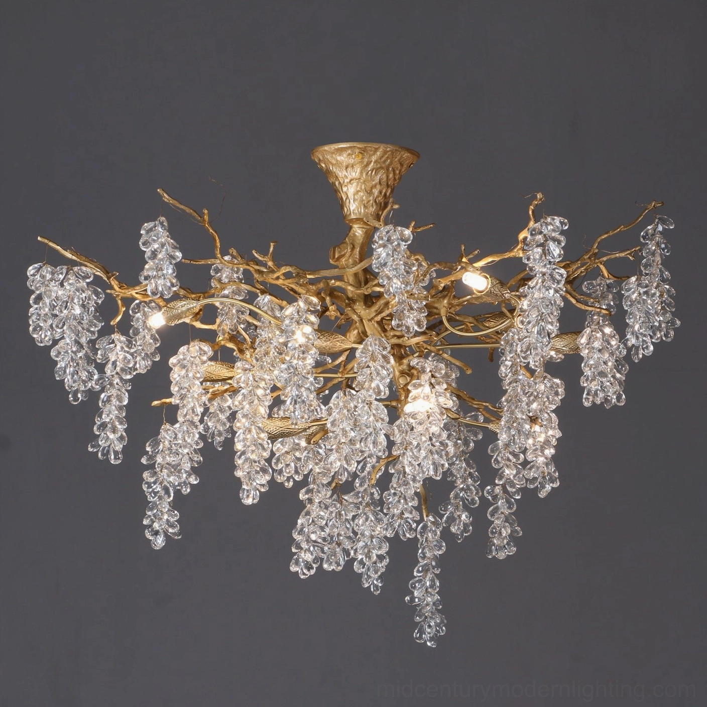 Antique brass grape bunch chandelier highlighting vintage patina finish and botanical-inspired design aesthetic