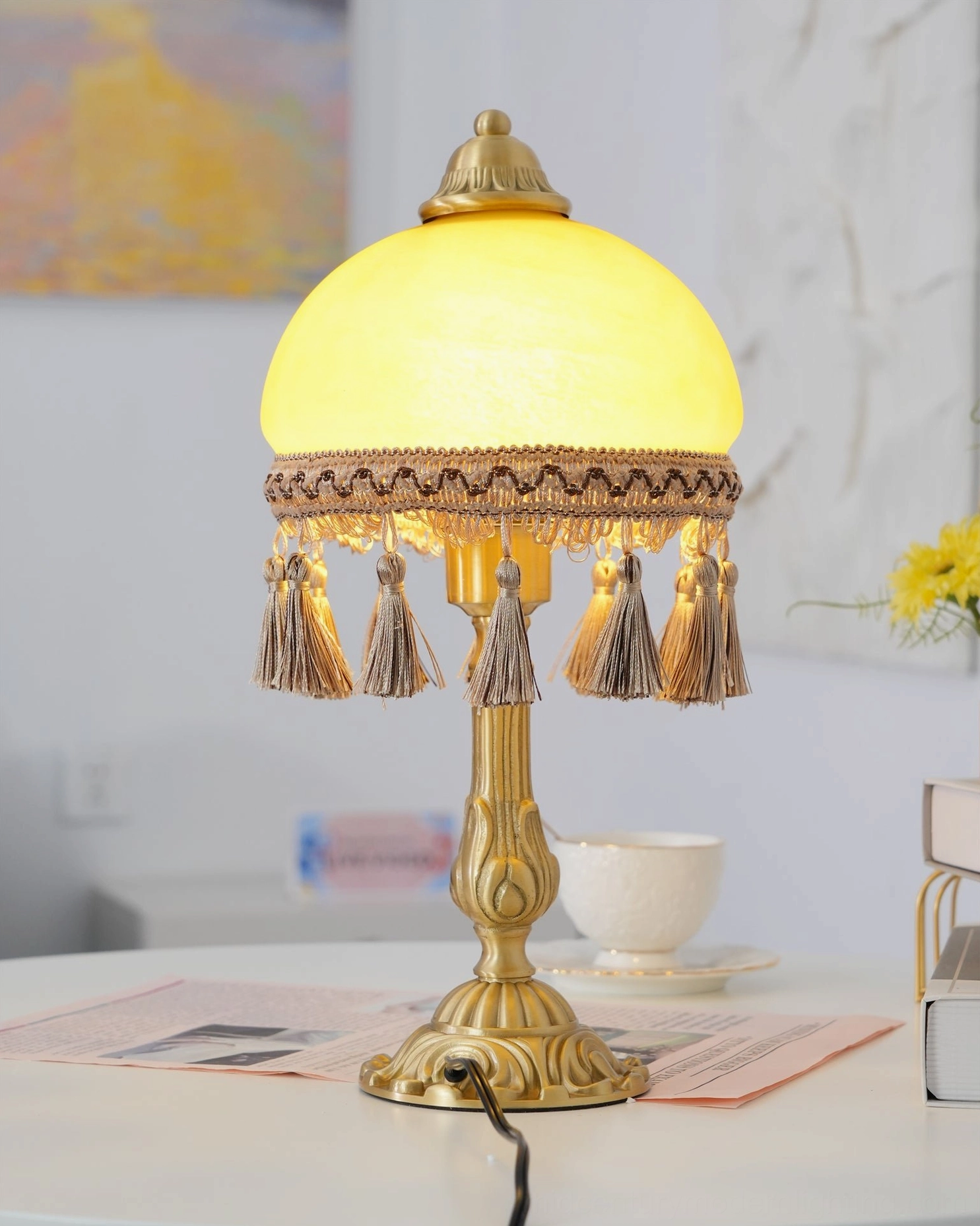 Antique brass table lamp with hand-finished brass base and fabric tassel border