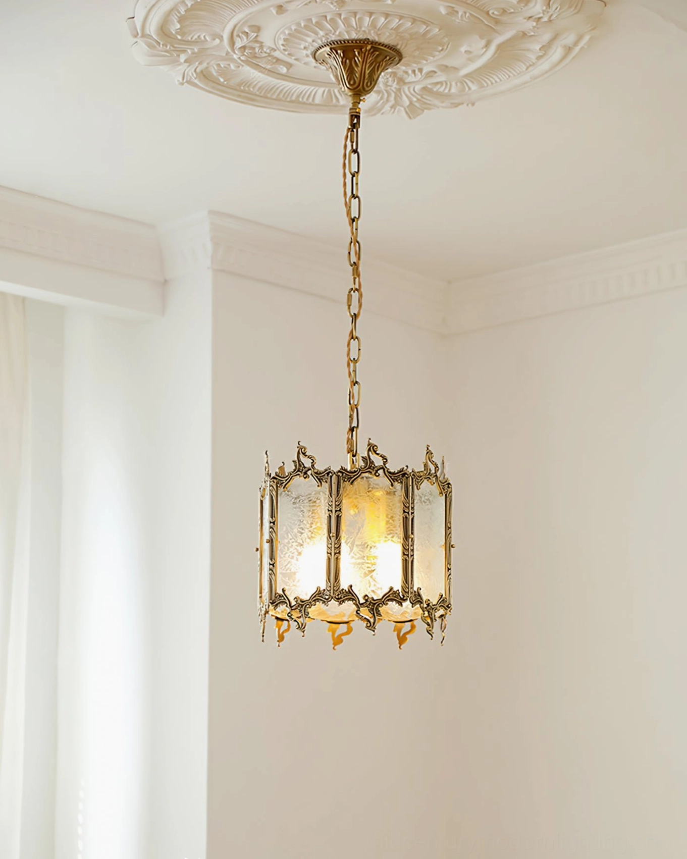 Antique brass lantern pendant with opaque frosted glass panels creating warm ambient light in sophisticated interior setting