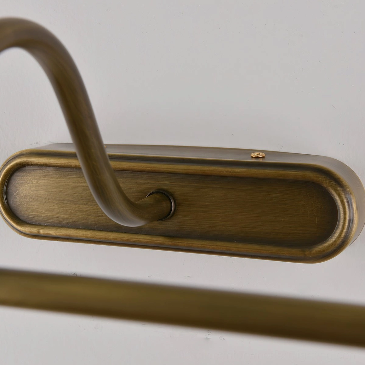 Antique brass finish wall sconce, integrated LED warm illumination, elegant fixture detail