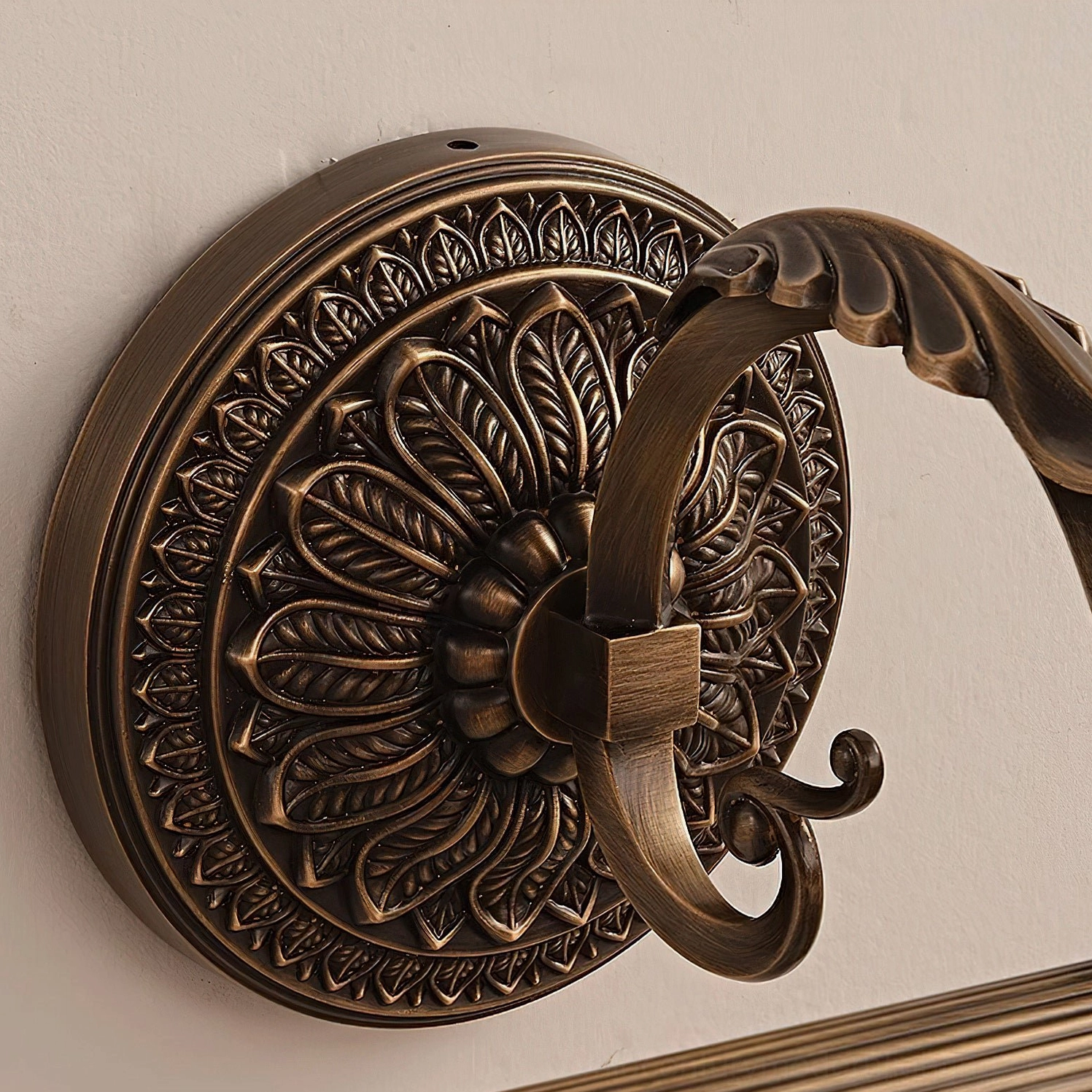 Ellesmere antique brass wall sconce mounted as picture light above framed artwork gallery wall