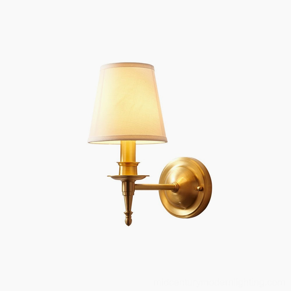 Antique brass wall sconce compact size - full fixture profile showing 5.5 inch arm projection and circular backplate
