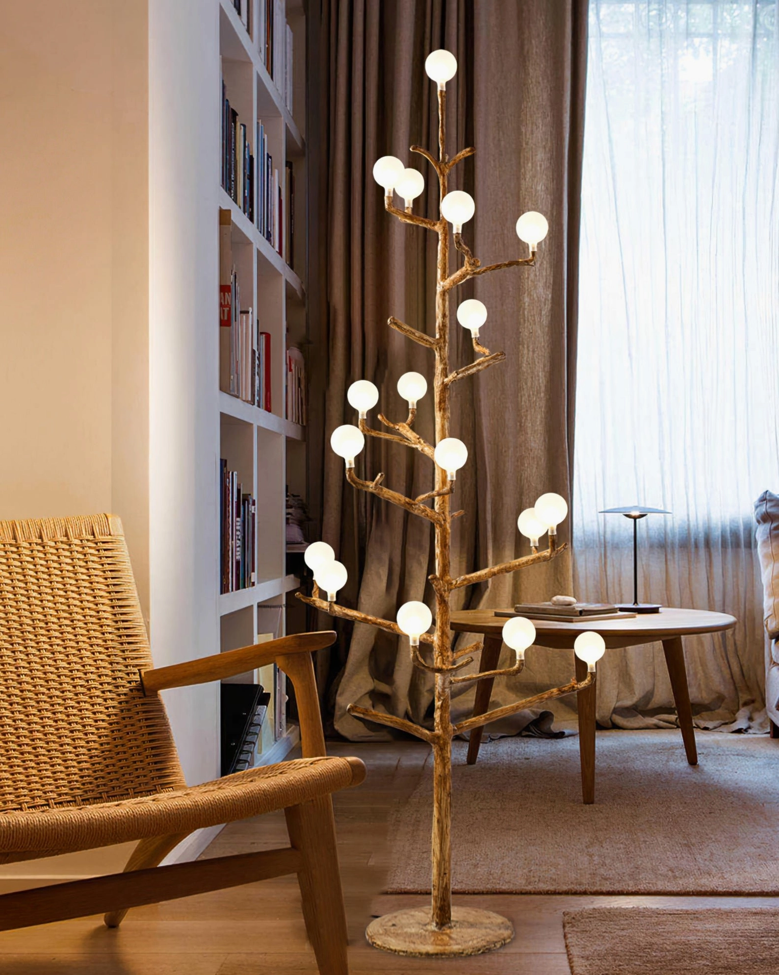 antler branch floor lamp in home study room with bookshelf and coffee table, providing warm functional lighting for reading and work spaces