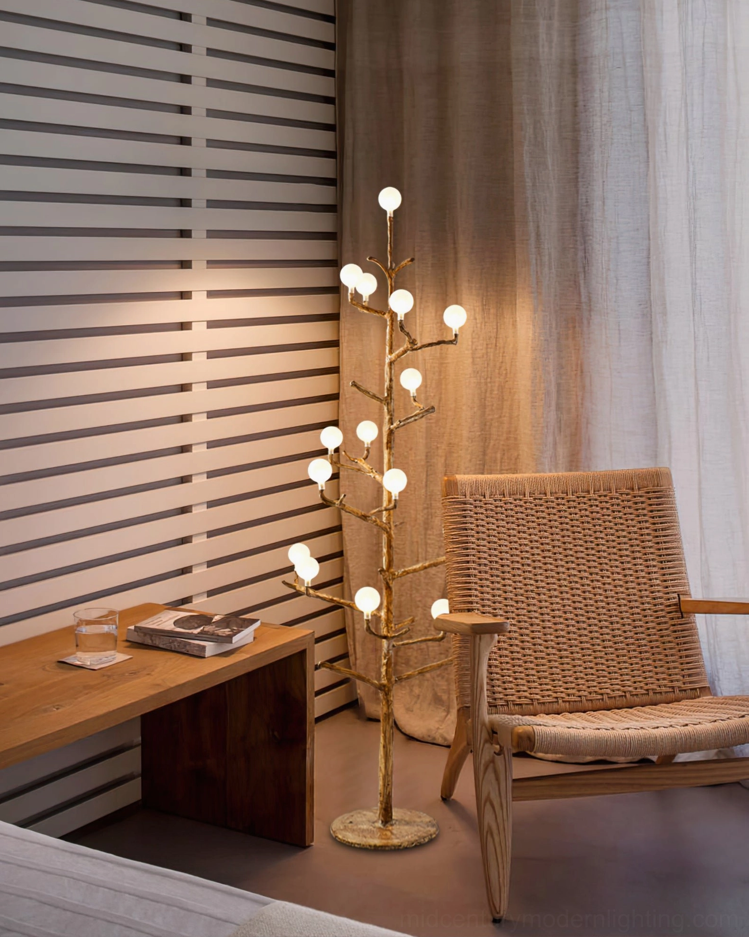 modern antler floor lamp styled with rattan furniture and earth-tone decor, creating warm ambient glow in contemporary interior design