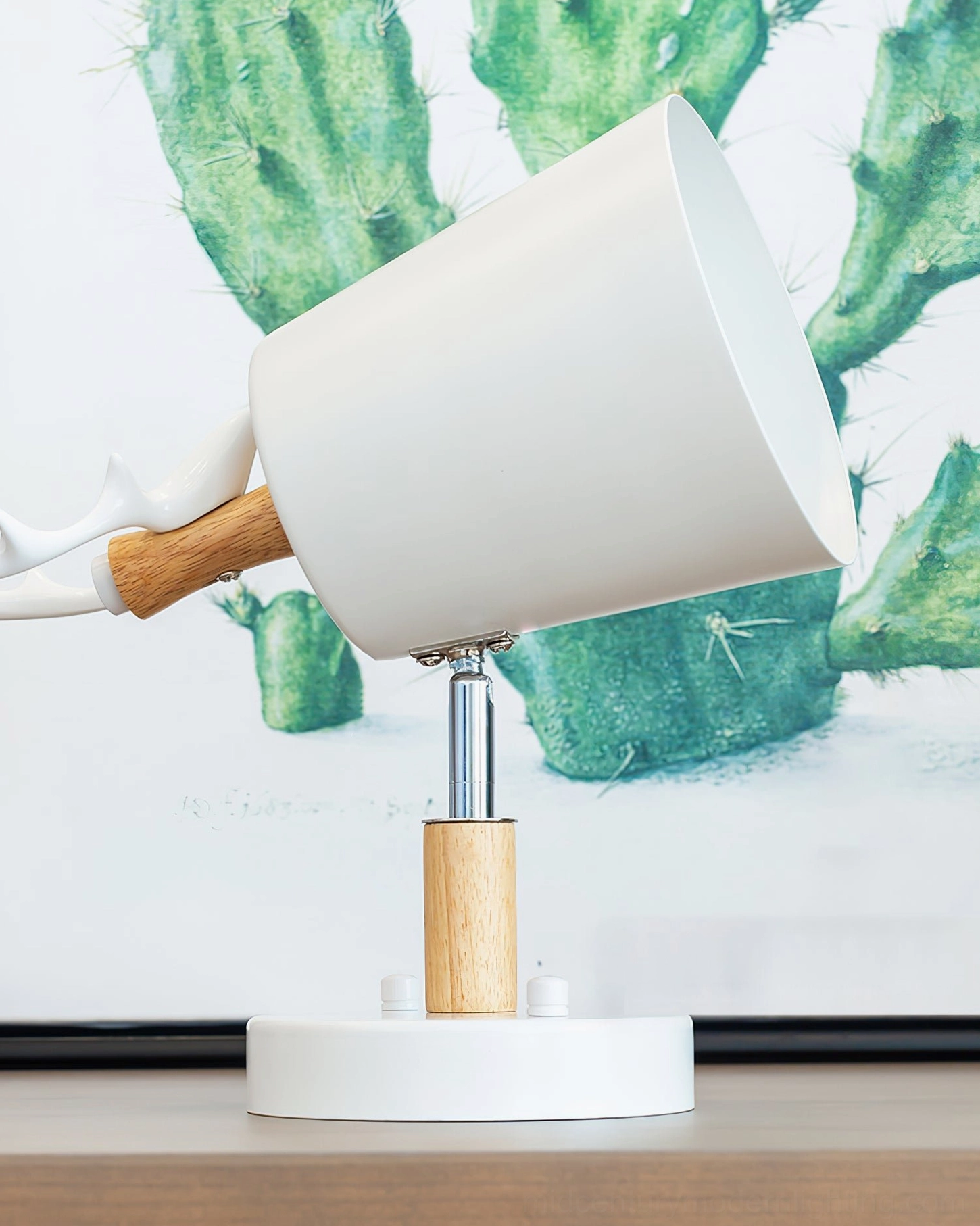 Antler wall lamp adjustment mechanism shown in bottom view, wooden shelf styling, warm LED illumination