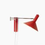 Anvia articulated plug-in wall lamp in red finish, minimalist mid-century modern design on white background