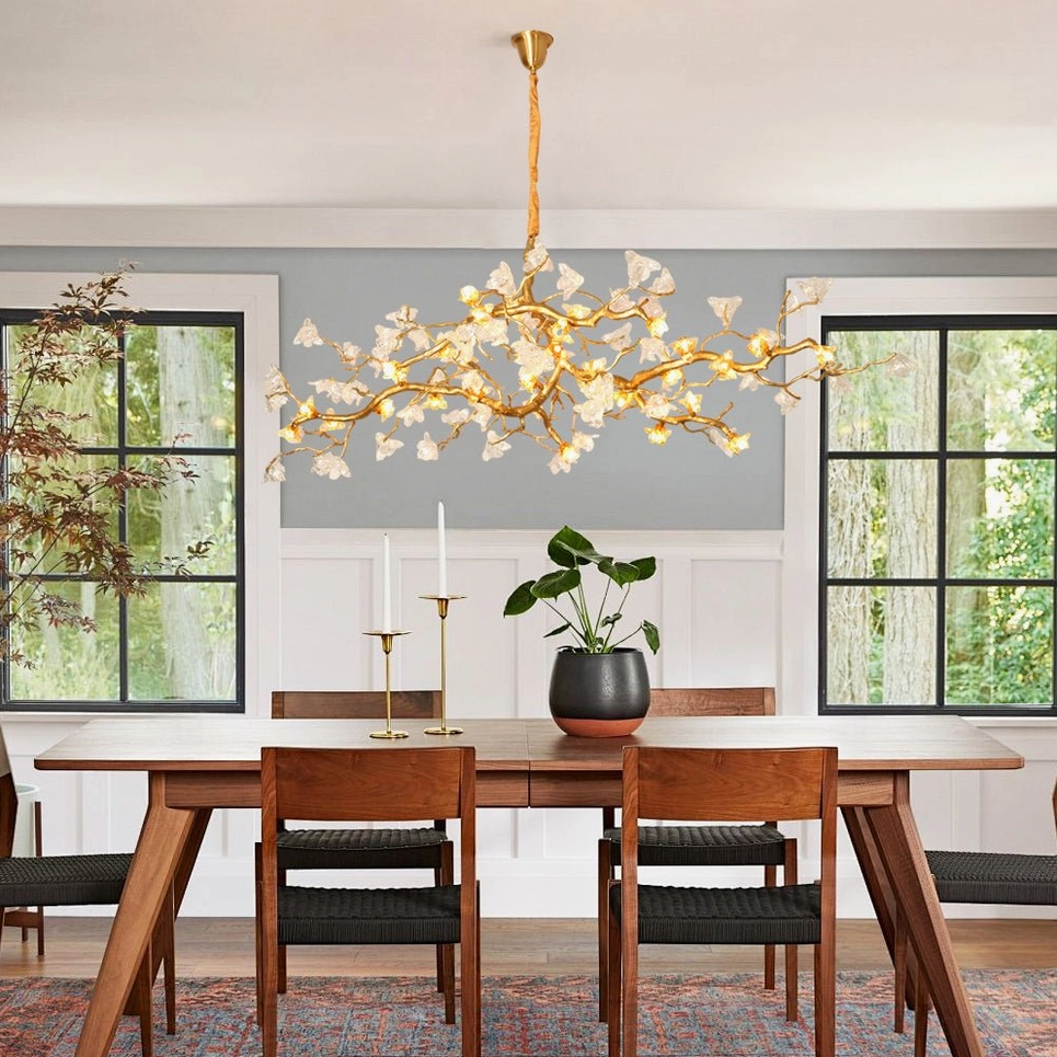 Aosta Branch Chandelier glowing above traditional family dining table with warm yellow Edison bulb lighting