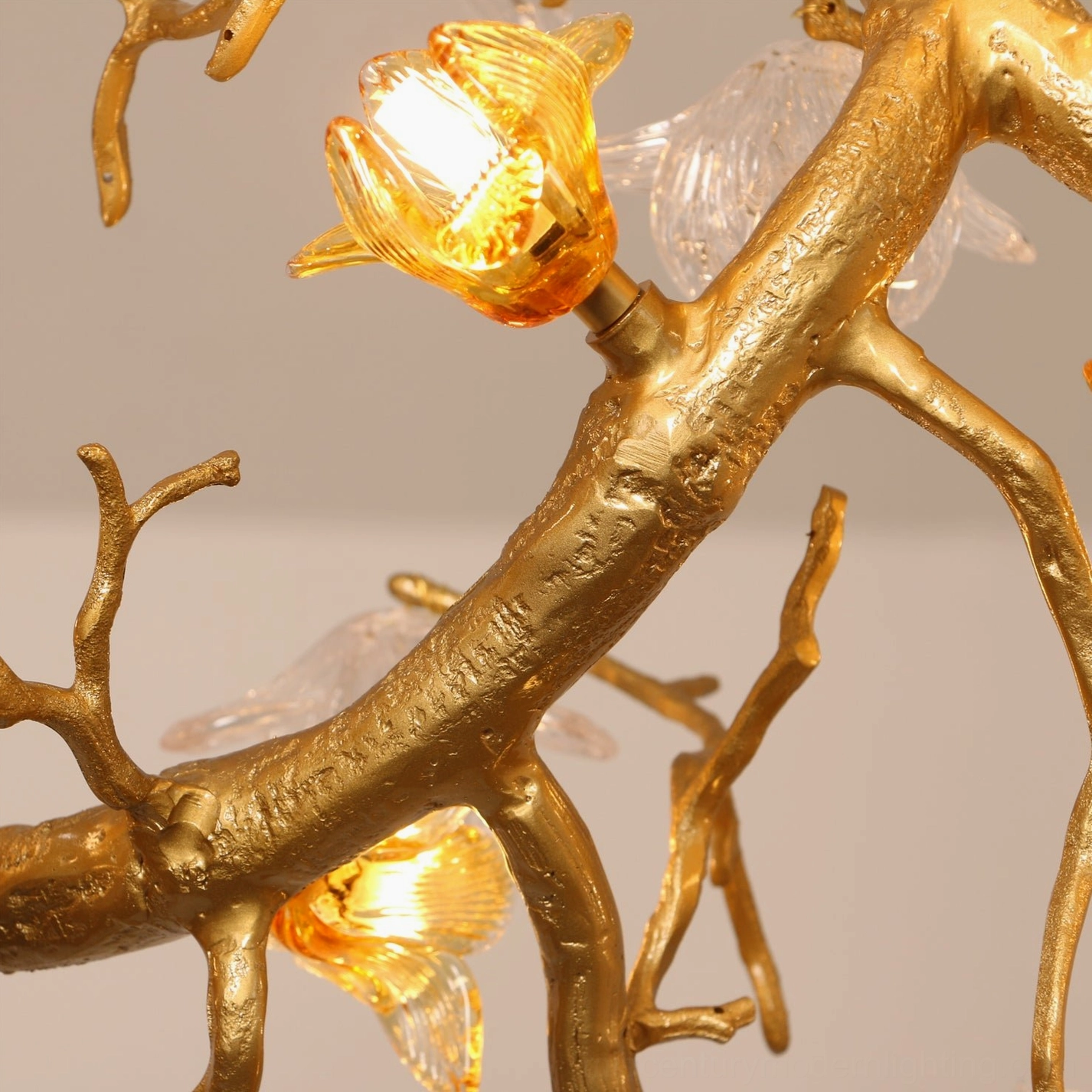 Detailed macro view of hand-formed glass flower petal with visible lighting and surface texture in Aosta chandelier