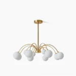 Apiales mouth-blown glass globe chandelier with frosted domes and brushed brass frame, overhead studio view