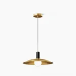 Aplomb brass pendant light with saucer shade on white background, modern minimalist ceiling fixture