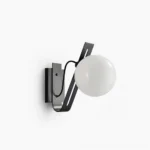 Black Arandela globe wall sconce with frosted glass shade, minimalist studio lighting design