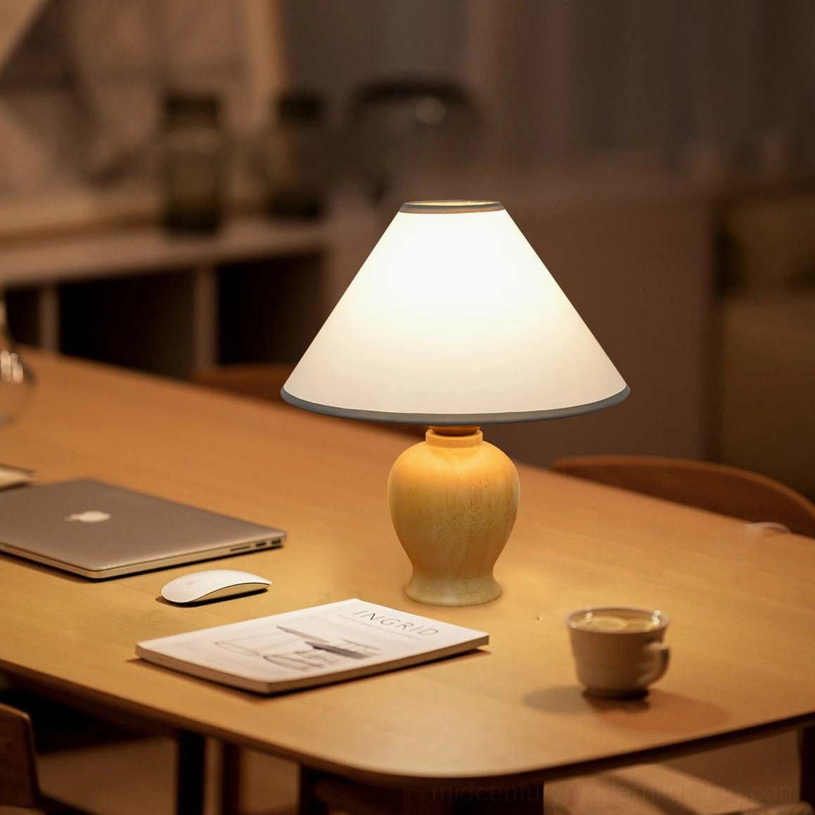 Arbol wooden table lamp in workspace with laptop coffee cup and notebook, side three-quarter view residential environment