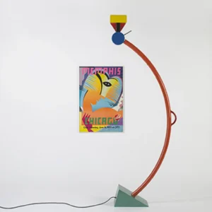 Modern arc floor lamp with reddish-brown curved arm and teal base in vintage-inspired interior space