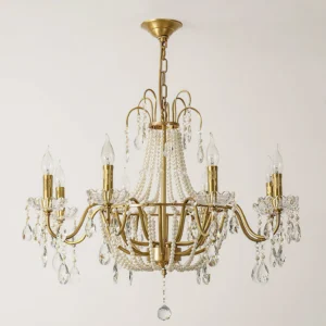 Front view of Arcadia crystal chandelier with matte gold brass frame and cascading crystal pendants
