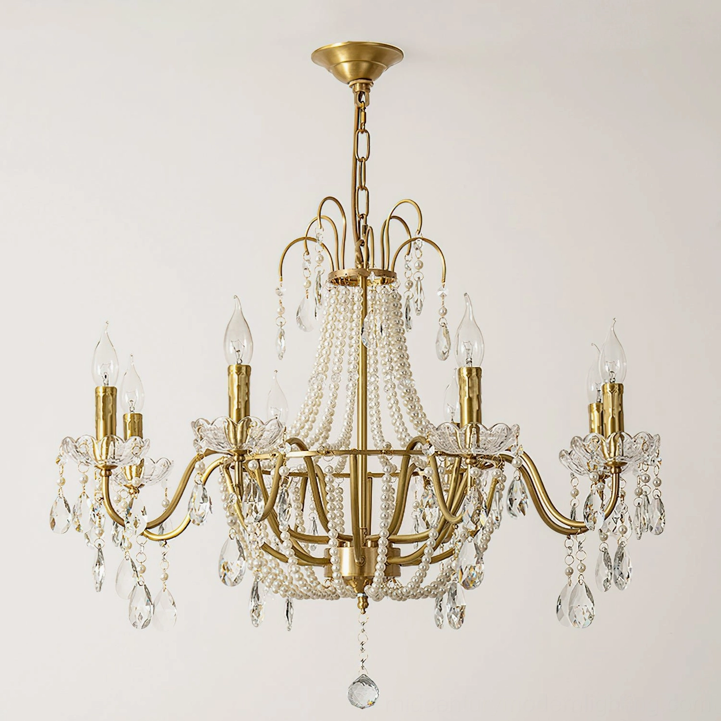 Front view of Arcadia crystal chandelier with matte gold brass frame and cascading crystal pendants