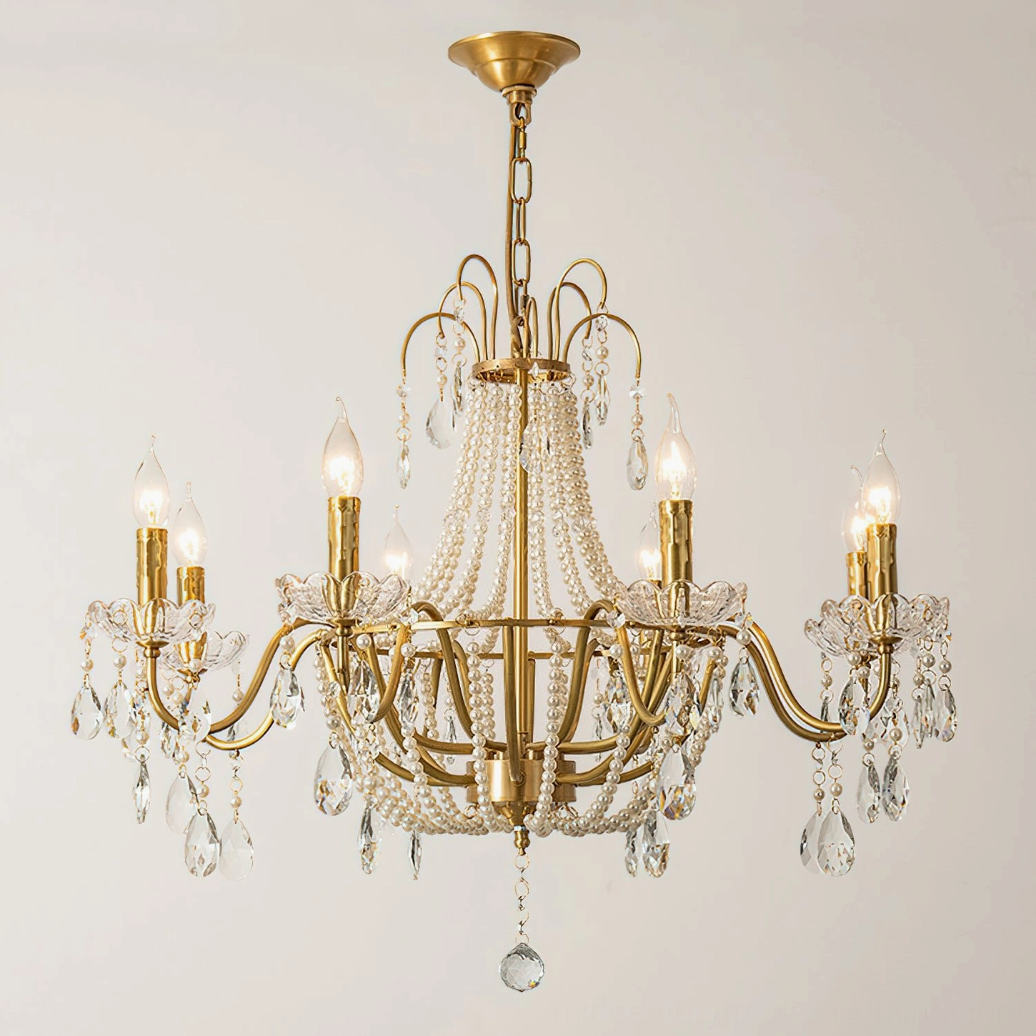 Gold brass Arcadia crystal candle chandelier with beaded center decoration, overhead view white background