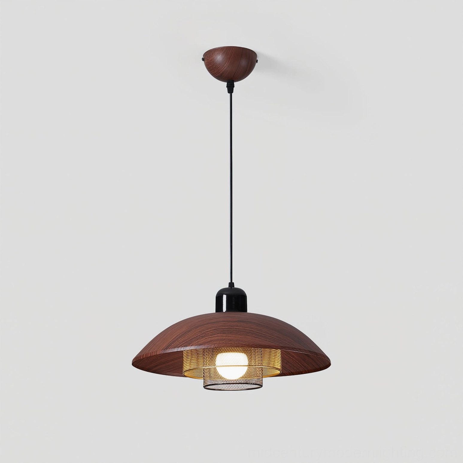 Arcadian pendant light with exposed vintage Edison bulb showing warm filament glow through mesh