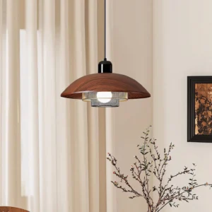 Arcadian pendant light installed in modern living room, showing warm ambient lighting and industrial design