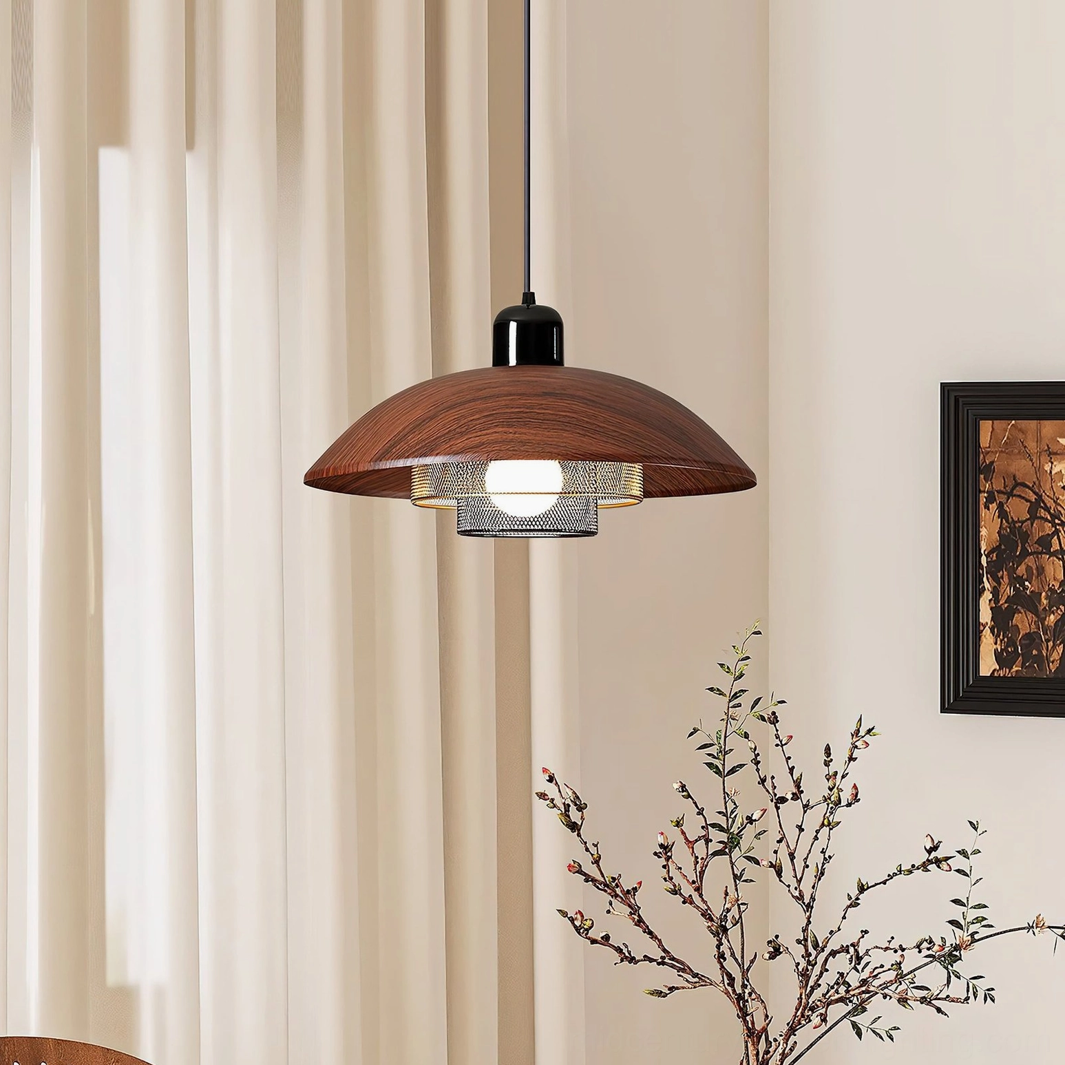 Arcadian pendant light installed in modern living room, showing warm ambient lighting and industrial design