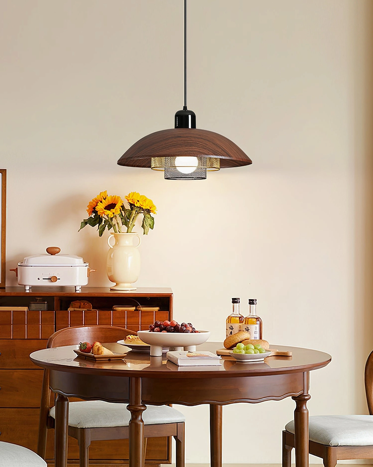 Arcadian pendant light in warm vintage dining area, creating intimate gathering atmosphere