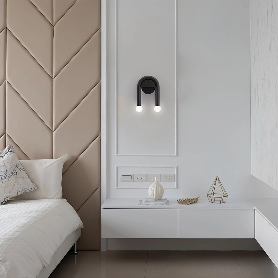Double arched wall sconce mounted above floating vanity unit in bedroom with chevron textured wall
