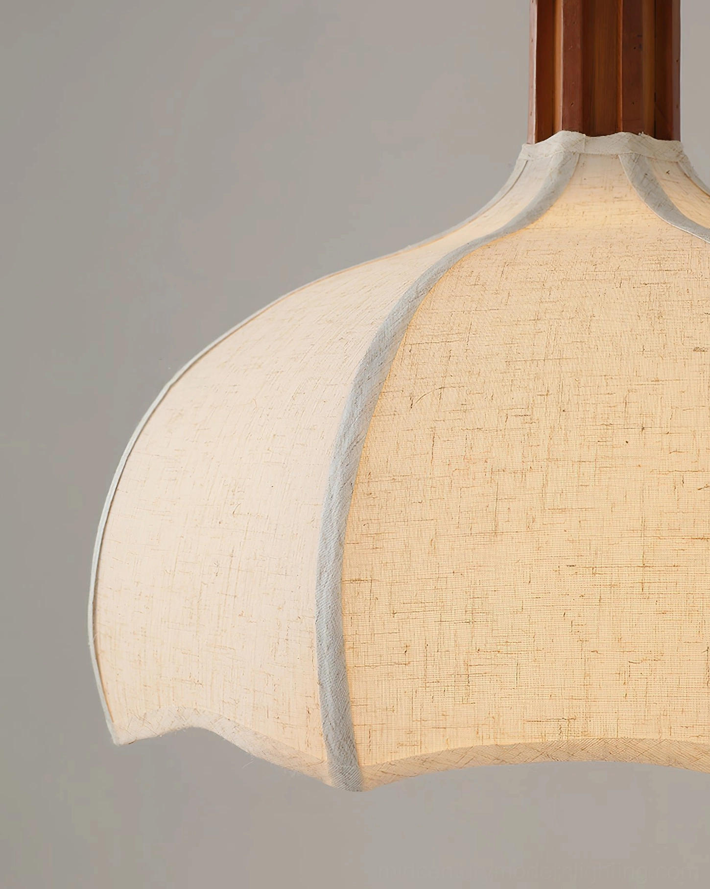 Textured woven linen shade of Arden pendant light with white trim edges and fabric detail