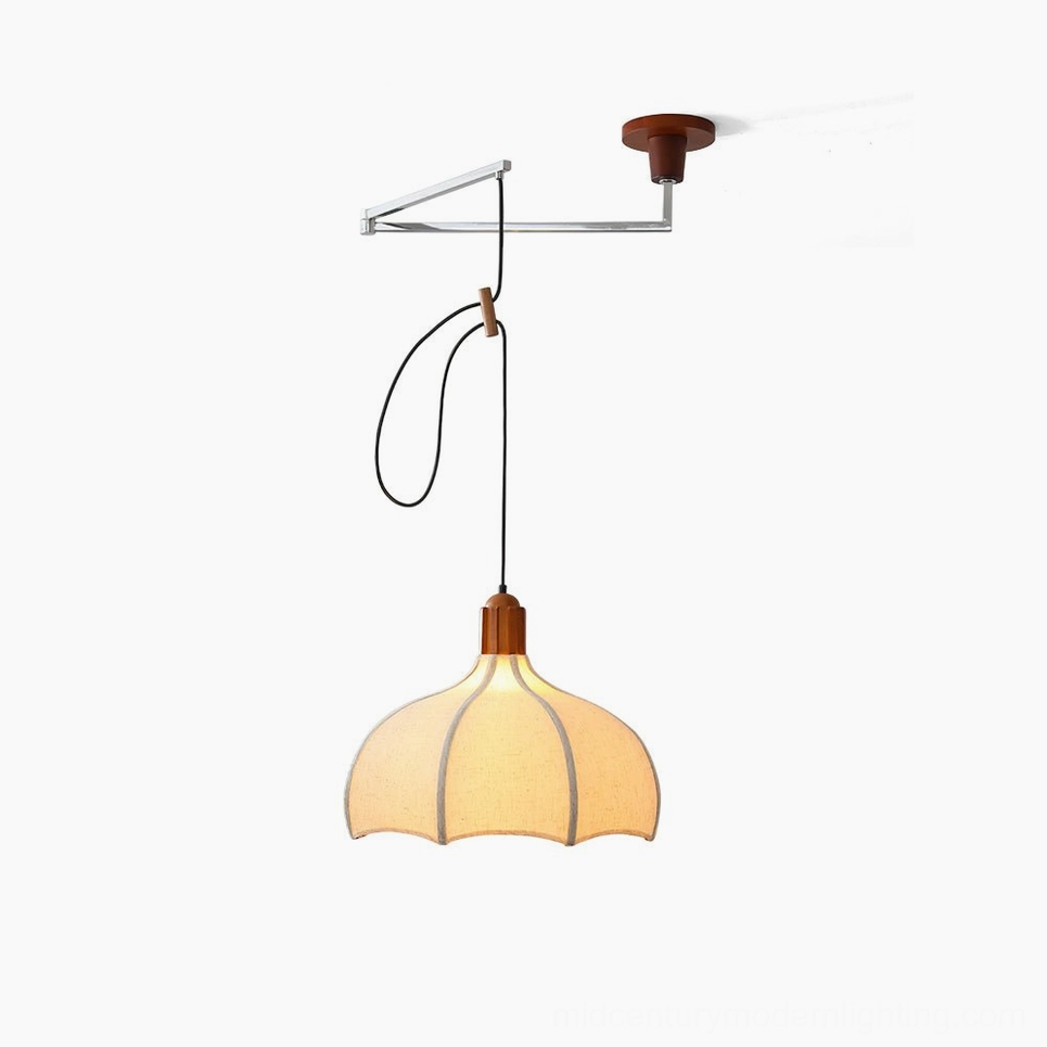 Arden swing arm pendant light with petal-shaped linen shade and walnut wood ceiling cap, studio view