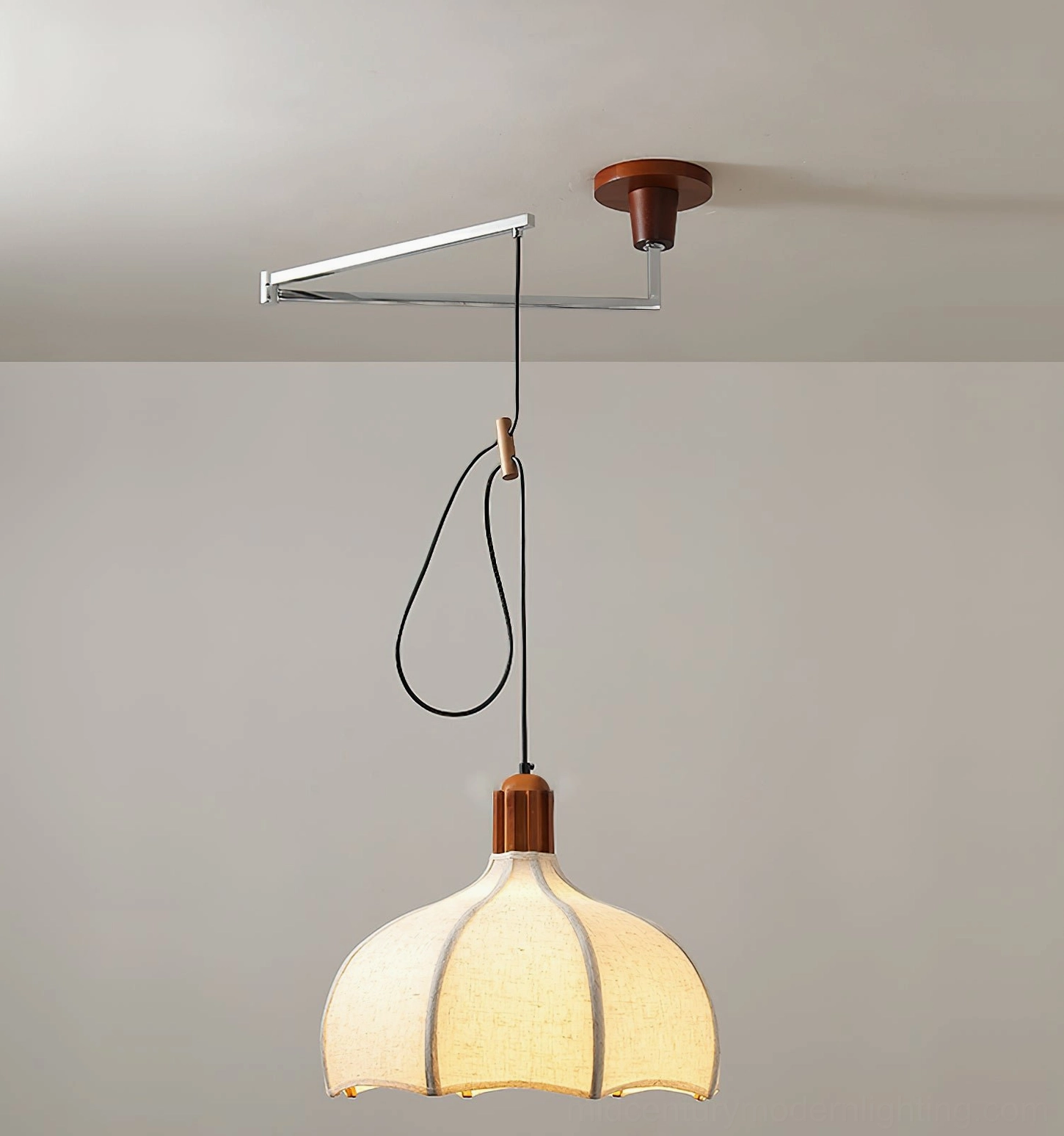 Arden pendant light three-quarter view showing metal swing arm mechanism and walnut wood mounting bracket