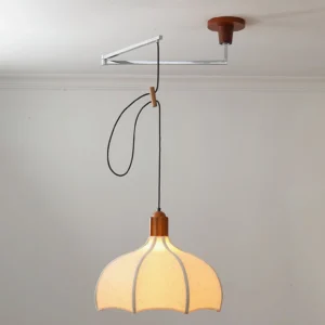 Mid-century modern swing arm pendant in white linen with adjustable black cord and walnut accent