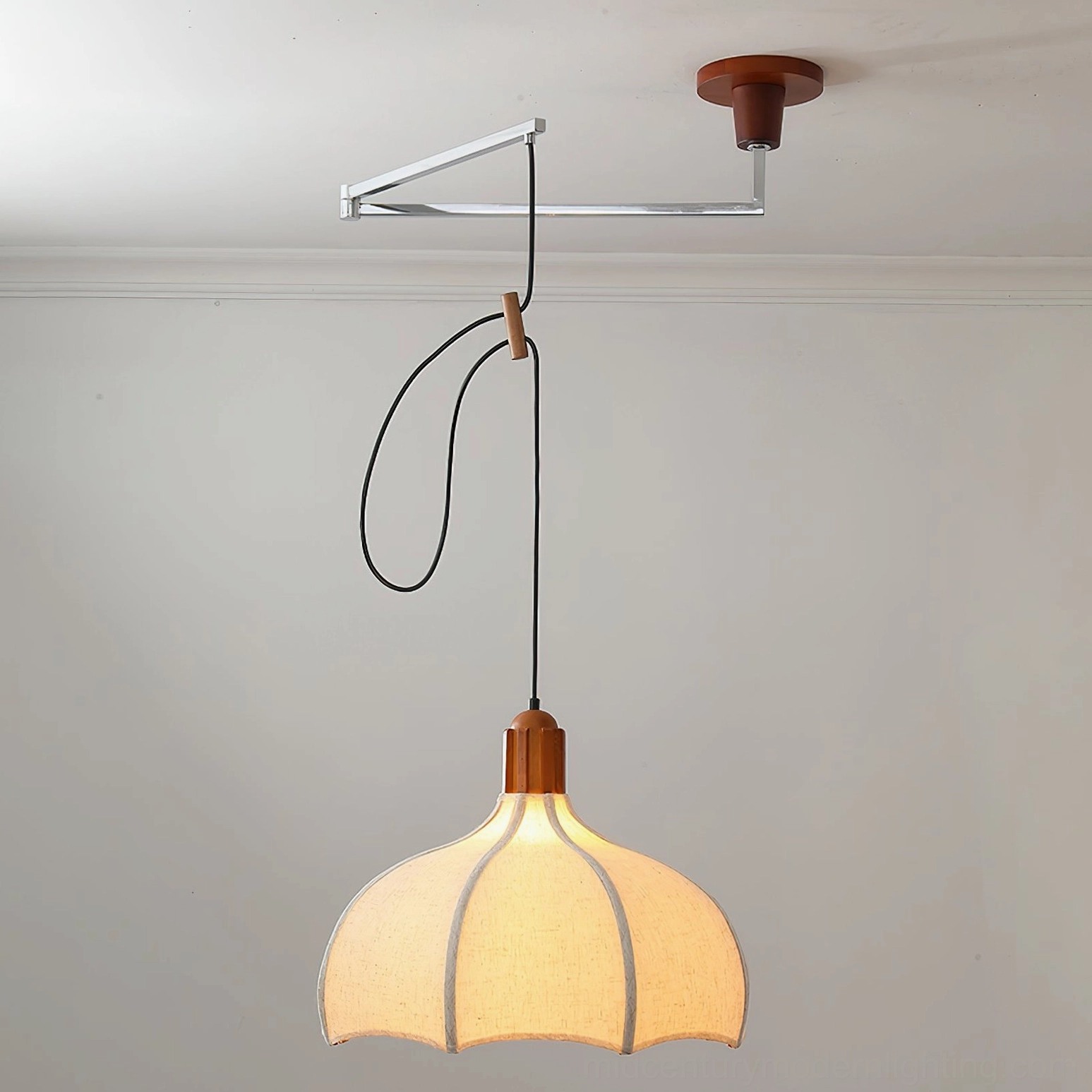 Mid-century modern swing arm pendant in white linen with adjustable black cord and walnut accent