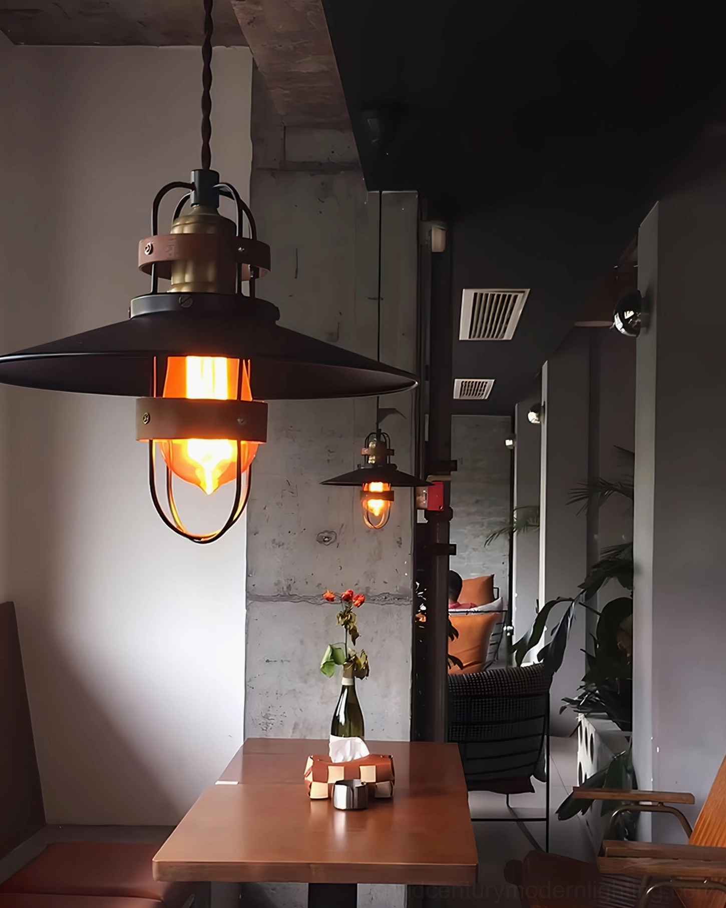 Arely industrial pendant fixture showing complete design with metal protective cage, wood straps, and suspended cord assembly