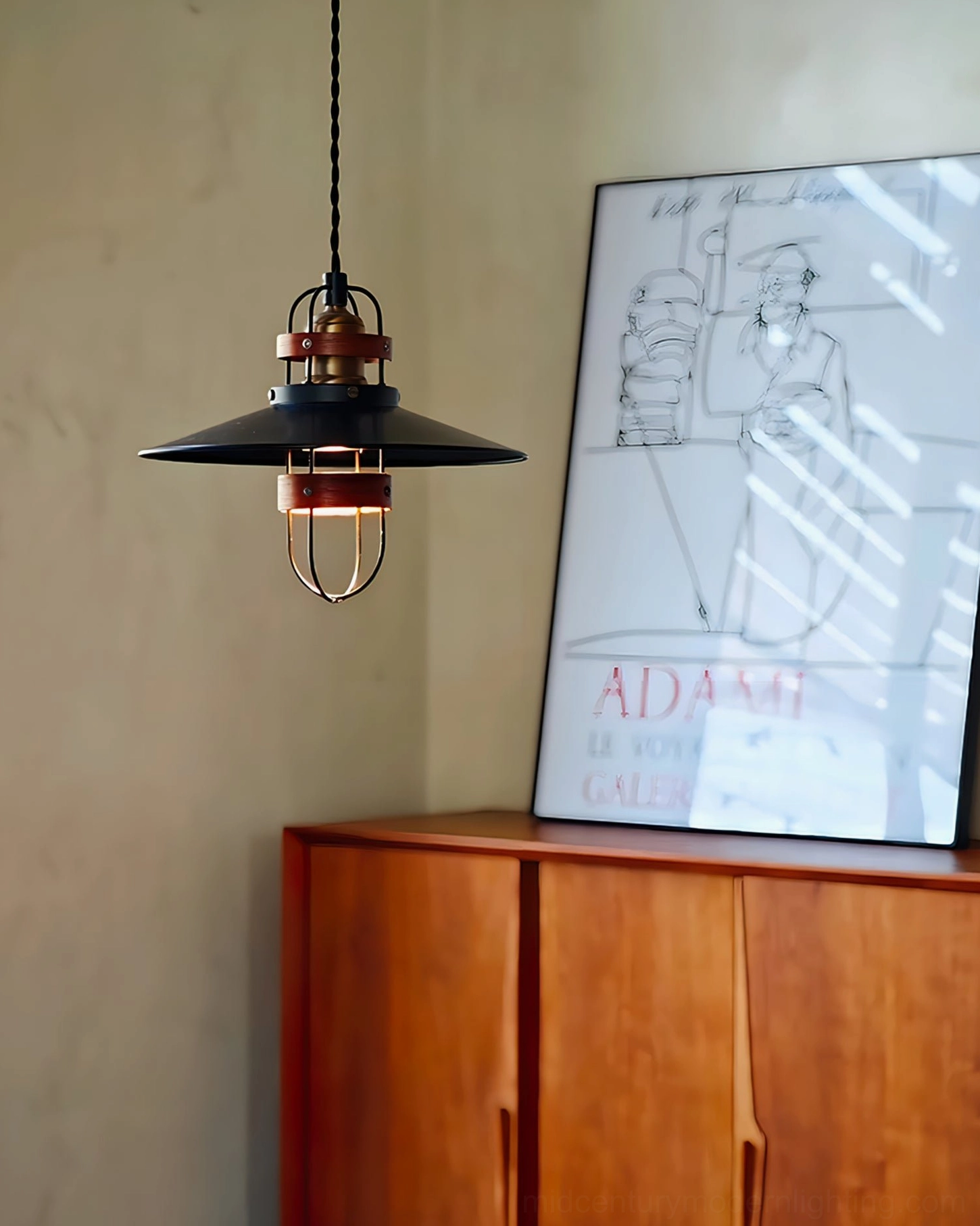 Arely industrial pendant lamp installed side view in home interior with wooden cabinet and wall art, vintage industrial decoration