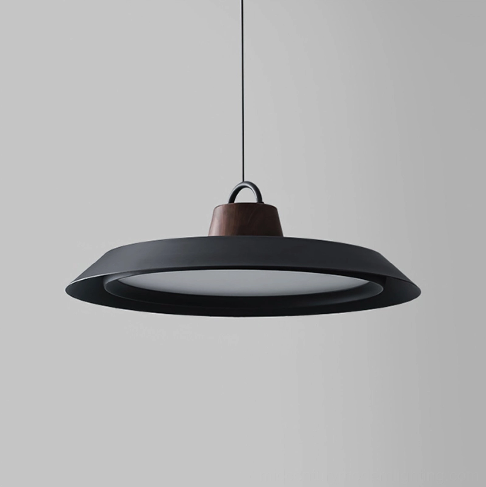 Sleek matte black Arenal pendant lamp showcasing contemporary minimalist design aesthetic