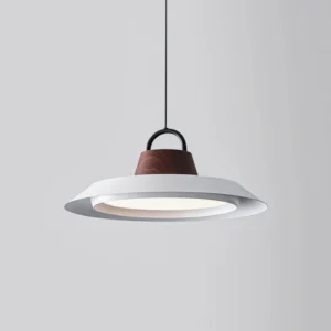 Close-up detail of Arenal disc pendant showing matte white finish and premium acrylic diffuser construction