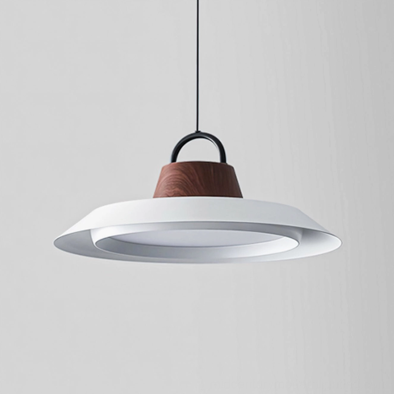Arenal white disc pendant with wooden accent detail, hanging against neutral background