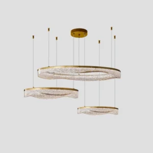 Modern multi-ring pendant light with polished brass hardware and frosted resin shades front view