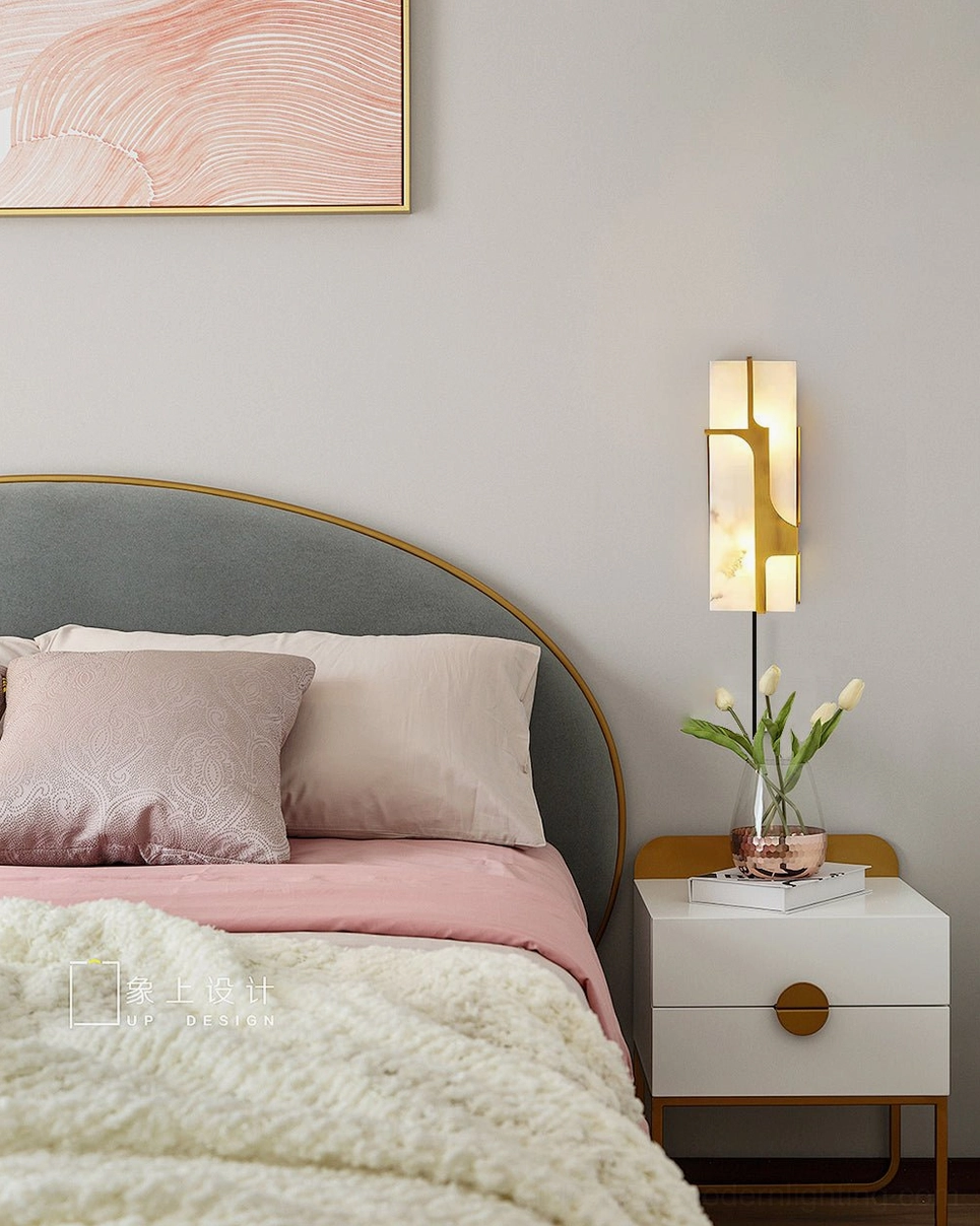 Ariel alabaster plug-in wall sconce as bedside lighting in warm neutral bedroom with pink bedding and flowers