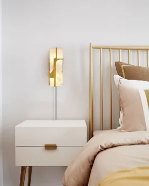 Ariel brass alabaster sconce as bedside table lamp in luxury modern bedroom with minimalist gold decor